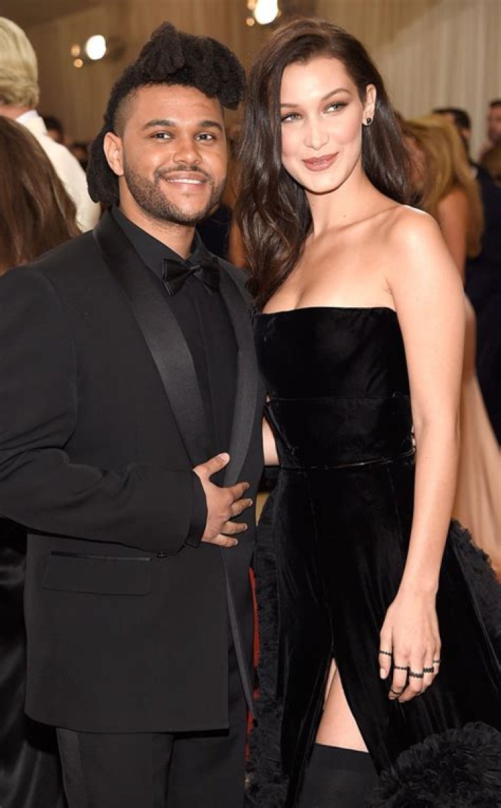 Bella Hadid and The Weeknd were spotted leaving her Manhattan NYC apartment on Friday night. The couple headed to dinner after reuniting following a busy Fashion Month for the Runway model. She flaunted her to-die-for abs in a crop top as they walked to their SUV. They were all smiles but they seemed to be playing coy about a large Diamond ring on Bella's hand. She hid one of her hands behind her back, while concealing an ENORMOUS diamond on the hand she had intertwined in the singer's. He covered the ring with 2 hands as they got into the car, just giving a quick glance at it. Pictured: Ref: SPL5028849 280918 NON-EXCLUSIVE Picture by: 247PAPS.TV / SplashNews.com Splash News and Pictures Los Angeles: 310-821-2666 New York: 212-619-2666 London: 0207 644 7656 Milan: +39 02 4399 8577 Sydney: +61 02 9240 7700 World Rights, No Portugal Rights