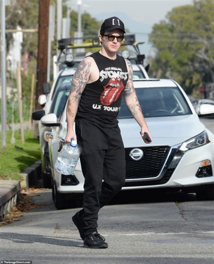 Drake Bell is seen for the first time since pleading guilty to child endangerment with a women who is believed to be his wife and a baby at Disneyland. The actor was seen celebrating his 35th birthday with his little family, putting his legal woes behind him as they enjoyed the happiest place on earth. **SPECIAL INSTRUCTIONS*** Please pixelate children's faces before publication.***. 27 Jun 2021 Pictured: Drake Bell. Photo credit: CelebCandidly / MEGA TheMegaAgency.com +1 888 505 6342 (Mega Agency TagID: MEGA765761_014.jpg) [Photo via Mega Agency]