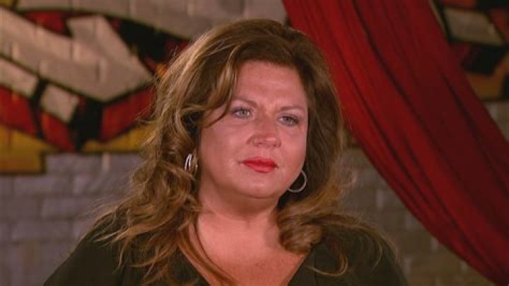EXCLUSIVE: Dance Moms star Abby Lee Miller doesn&rsquo;t flinch as a gymnast SOMERSAULTS over her during an outing to an LA beach. The reality TV star, 55, bravely lay back in her wheelchair as the muscular shirtless performer ran towards her then vaulted above her. Miller, who shot to fame as the star of hit show Dance Moms, has been using a wheelchair after undergoing surgery to remove a tumor from her spinal cord after reportedly being diagnosed with a form of cancer called Burkitt Lymphoma. Miller&rsquo;s visit to the beach in Santa Monica, CA, saw her talking to a man and a woman dressed in workout gear before giving him a series of dance lessons. An onlooker said: &ldquo;Abby was in great form and started giving the guy dance lessons. "She was teaching him to move and how and when to move his feet and it seemed he was struggling to get the hang of it. It was like she was back on the show Dance Moms and was shouting orders at him to &lsquo;move to the side&rsquo; or &lsquo;back right&rsquo;. She appeared to be trying to teach him ballet just like she did to kids on the series. &ldquo;It looked the guy had some gymnastic training and so afterwards they did a stunt where he ran at her and somersaulted directly above her.&rdquo; Miller spent eight seasons on Dance Mom and previously taught Joelle Joanie &ldquo;Jojo&rdquo; Siwa. In 2017 she was sentenced to 366 days in prison for bankruptcy fraud. 31 Aug 2021 Pictured: Abbey Lee Miller. Photo credit: KAT/MEGA TheMegaAgency.com +1 888 505 6342 (Mega Agency TagID: MEGA782922_021.jpg) [Photo via Mega Agency]