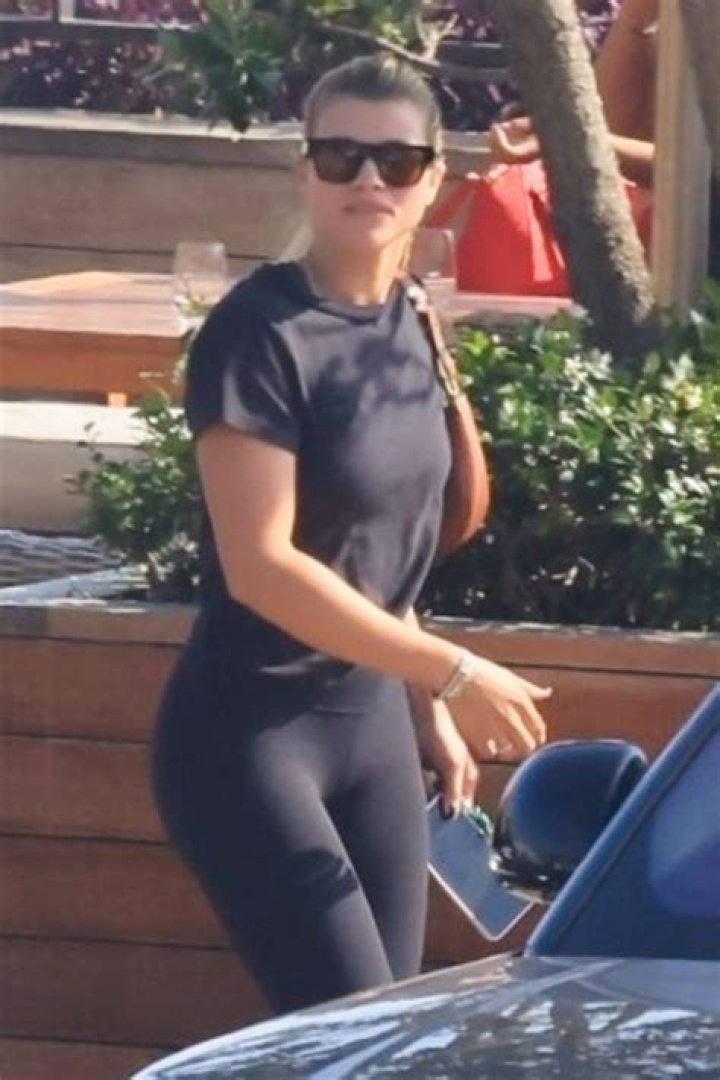 *EXCLUSIVE* Malibu, CA - Sofia Richie holds on tight to Scott Disick as they have some fun riding a motorbike on the beach in Malibu during the COVID-19 safer at home order. *Shot on April 22, 2020* Pictured: Sofia Richie, Scott Disick BACKGRID USA 24 APRIL 2020 BYLINE MUST READ: RMBI / BACKGRID USA: +1 310 798 9111 / UK: +44 208 344 2007 / *UK Clients - Pictures Containing Children Please Pixelate Face Prior To Publication*