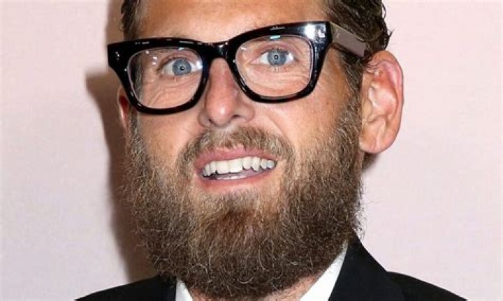 Jonah Hill gives a serious look while protesting