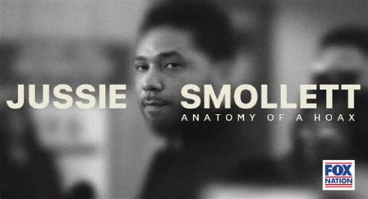 Jussie Smollett holds his copy of a magazine