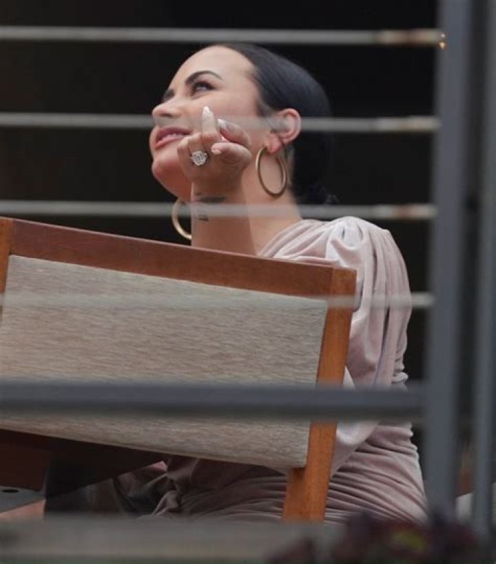 Malibu, CA - Demi Lovato and Max Ehrich are escoted back to their car by security after a dinner date at Nobu in Malibu. Pictured: Demi Lovato, Max Ehrich BACKGRID USA 22 JULY 2020 BYLINE MUST READ: Roger / BACKGRID USA: +1 310 798 9111 / UK: +44 208 344 2007 / *UK Clients - Pictures Containing Children Please Pixelate Face Prior To Publication*