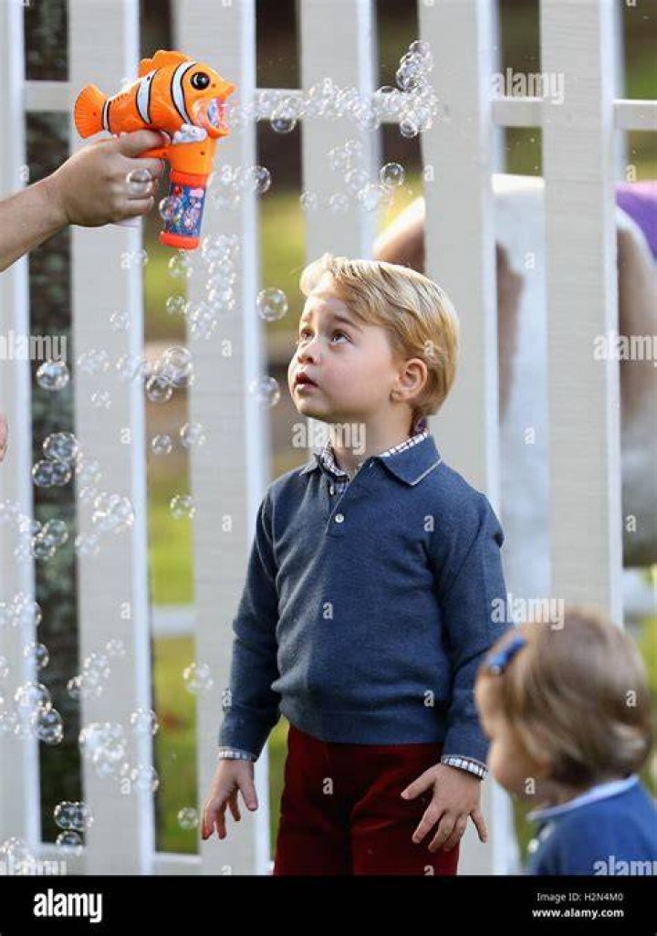 Prince George plays with bubbles
