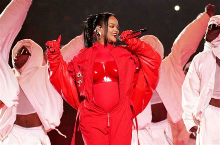Rihanna performing during the halftime show Philadelphia Eagles v Kansas City Chiefs, Super Bowl LVII, NFL, Half Time Show, University of Phoenix Stadium, Glendale Arizona, USA - 12 Feb 2023 Wearing Alaia, Coat, Wearing Loewe, Breast Plate