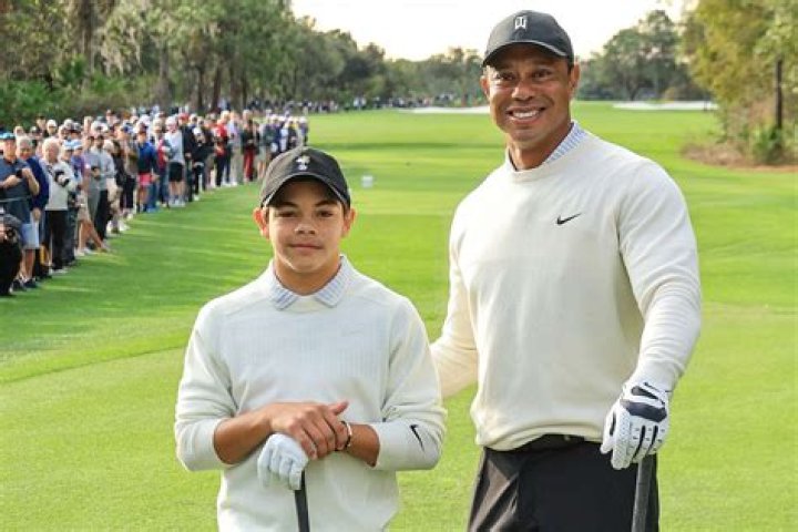 Tiger Woods, right with his daughter Sam Alexis Woods, left, and his girlfriend Erica Herman, center, walk along the Colonnade following a ceremony where President Donald Trump awarded the Presidential Medal of Freedom to Tiger Woods at the White House in Washington, Monday, May 6, 2019. (AP Photo/Manuel Balce Ceneta)